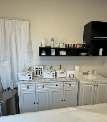 Annie's Beauty and Body Waxing 22 Professional waxing supplies and equipment organized in a clean studio environment.