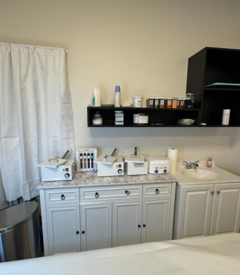 Annie's Beauty and Body Waxing 19 Professional waxing supplies and equipment organized in a clean studio environment.